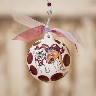 Glory Haus Mississippi State Ball Ornament. (MSU) “You Can Wrap This One Up in Maroon & White” with the bulldog Mississippi State University porcelain ball Christmas ornament. A must-have for all MSU fans! Comes with a Decorative Ribbon & Packaged in a Gift Box for Perfect Presentation.
