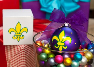Coton Colors New Orleans Saints Painted Christmas Ornaments. The 100mm Round Glass Fleur De Lis Purple Ornament Is Designed with a Stylized Lily Accented By a Dot Pattern.