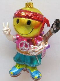 December Diamonds 60’s Smiley Face Hippie Boy Baby Boomers Blown Glass Ornament. He is wearing Blue Clogs,Peace Sign Shirt,holding up the two Peace Sign Fingers.Guitar strapped to his back. He’s ready for Woodstock! Unique Fun Discontinued Ornament.