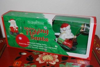The Enchanted Workshop Merry Fishing Santa Raises & Lowers Ornaments