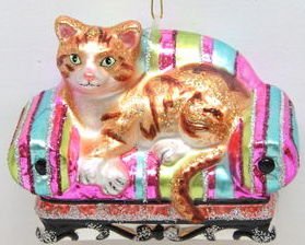 December Diamonds Blown Glass Tabby Cat on Pink & Blue Stripe Sofa Ornament.