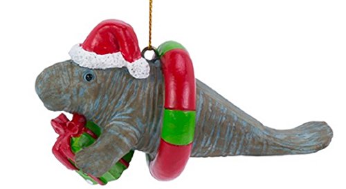 Manatee Christmas Ornament with Santa Hat Carrying a Present