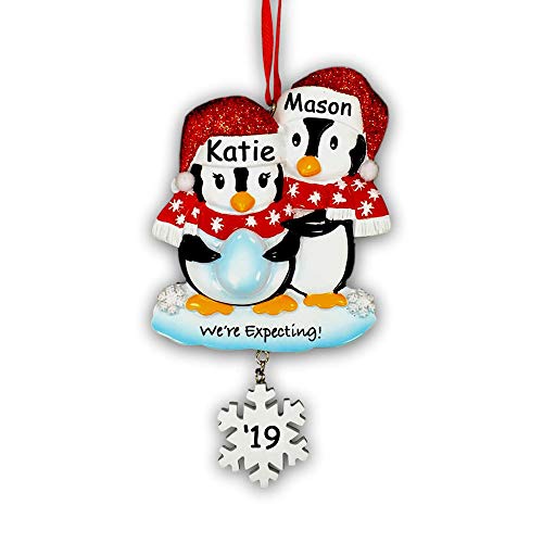 Personalized Pregnant We’re Expecting Penguin Couple with Baby Egg with Glittered Santa Stocking Cap and Scarves and Snowflake Detail Hanging Christmas Ornament with Custom Name and Date (Optional)